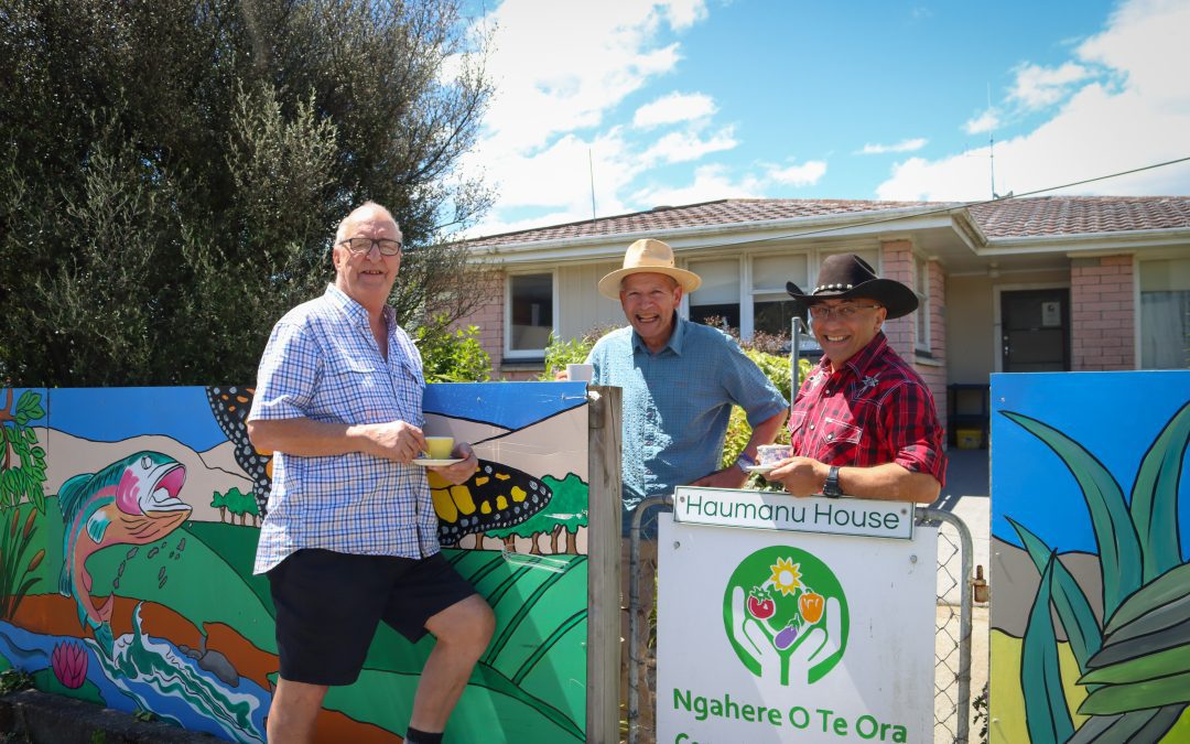 Gary, Martin, and Mayor Ron enjoy a cuppa and a chat Over the Fence at Carterton's Haumanu House.