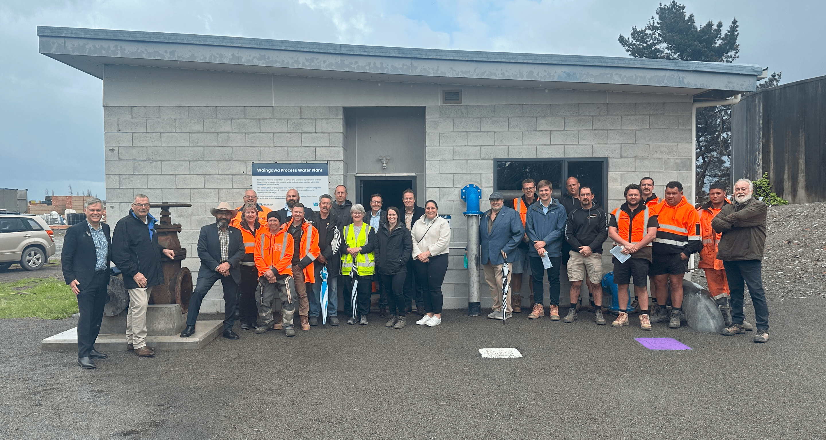 Group photo outside plant